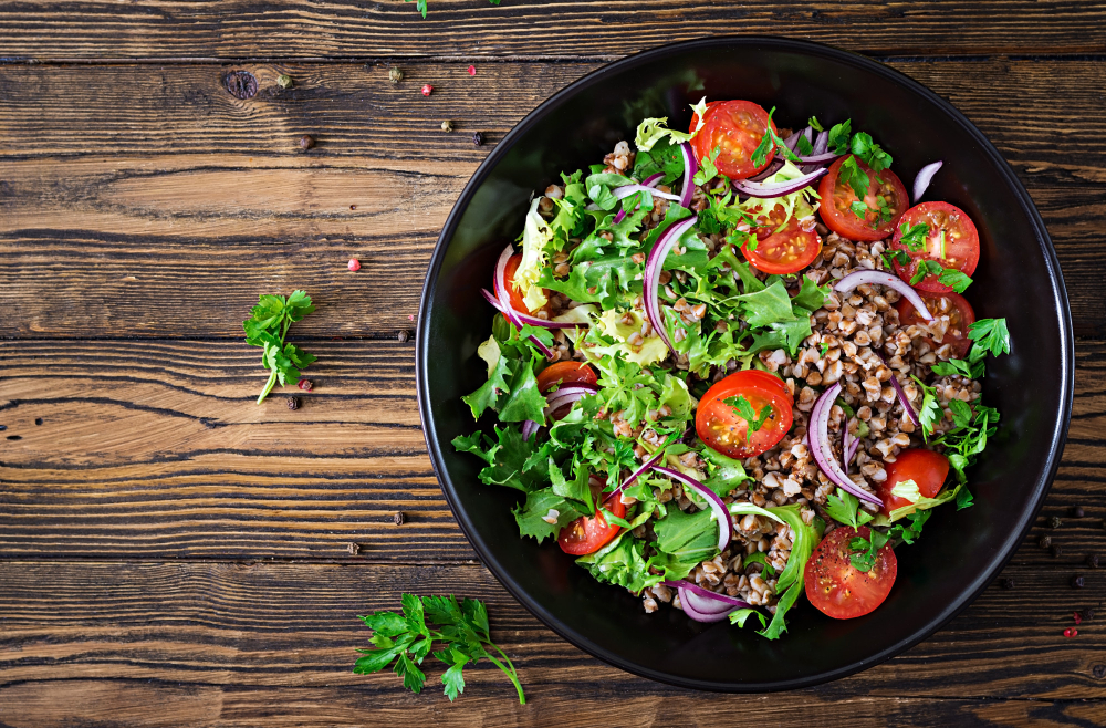 Earth salad- miami buckwheat-salad-with-cherry-tomatoes-red-onion-fresh-herbs-vegan-food-diet-menu-top-view-flat-lay